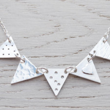 Behind the Sparkle: Our Sterling Silver Bunting Necklace Story