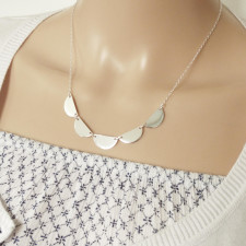 Your Scalloped Silver Necklace: A Whisper from the Sea