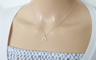 Good Luck Charm: The Story Behind Your Tiny Silver Horseshoe Necklace